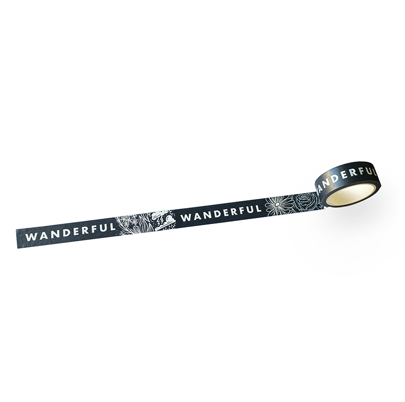 Washi tape roll with dark blue strip, moon-and-flower pattern and WANDERFUL text