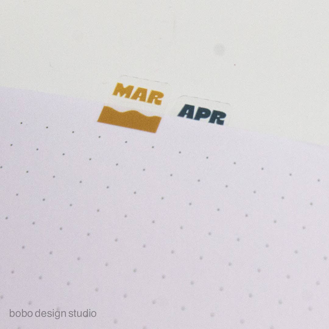 Orange MAR and APR month index sticker tabs