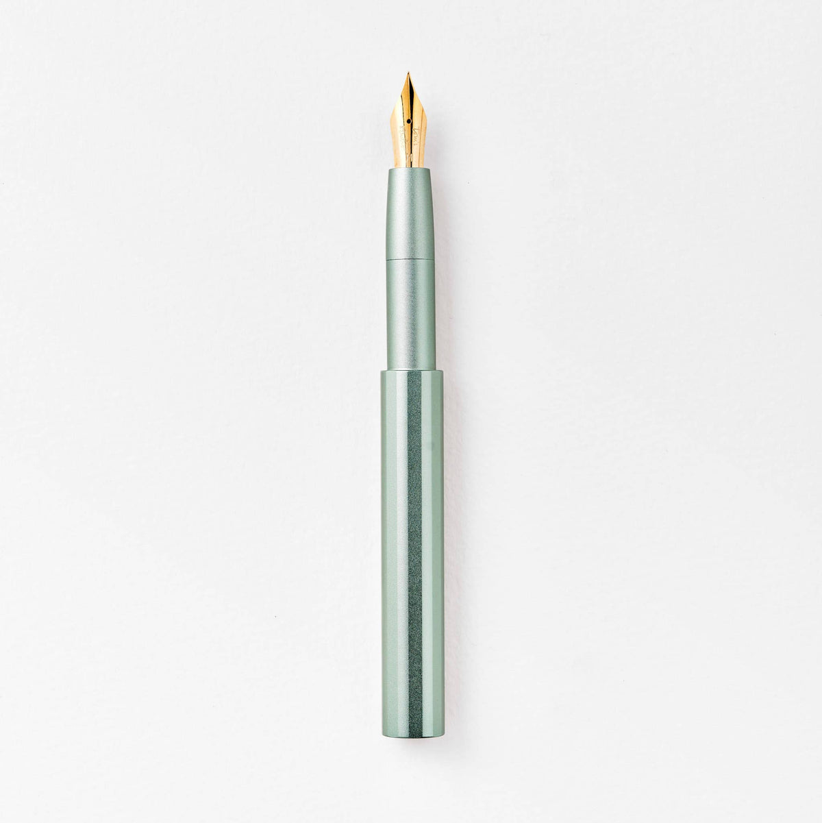 Seafoam fountain pen with gold nib and translucent mint barrel