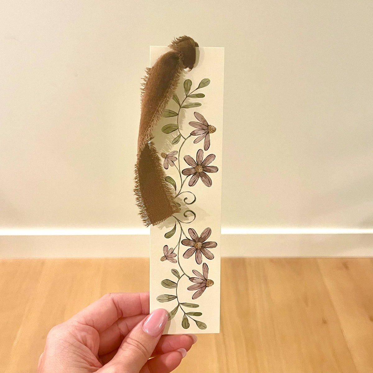 Double-sided bookmark with purple floral print and dark velvet ribbon tie