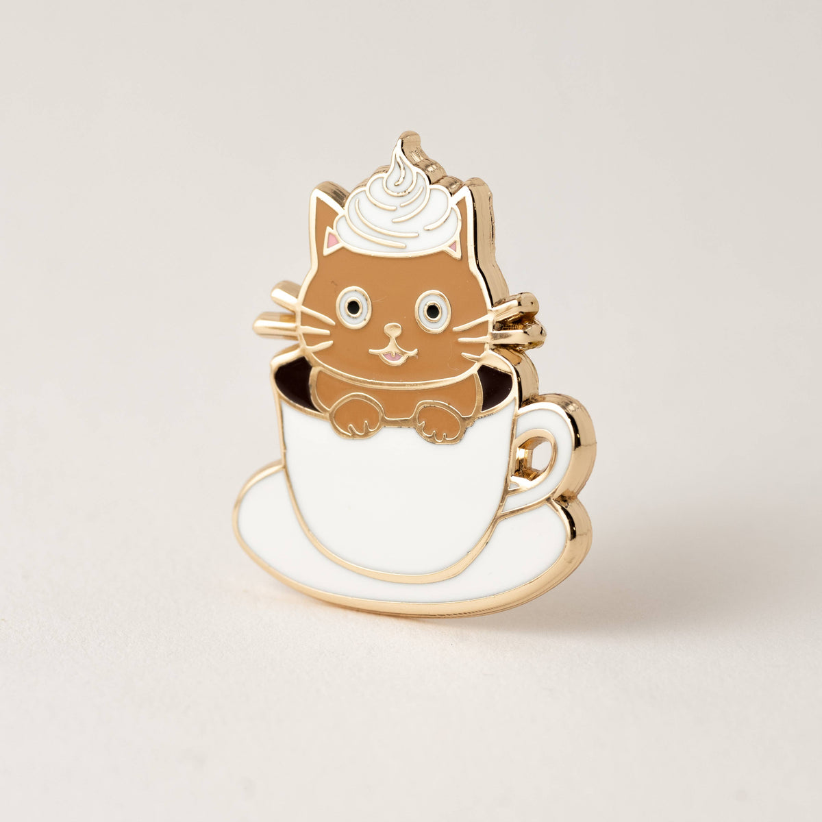 Cat latte enamel pin with brown cat wearing a whipped-cream hat on a coffee cup