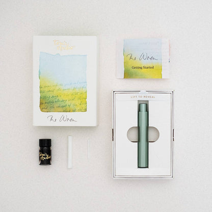 Refillable writing pen gift box, sage-green pen shown in a windowed package
