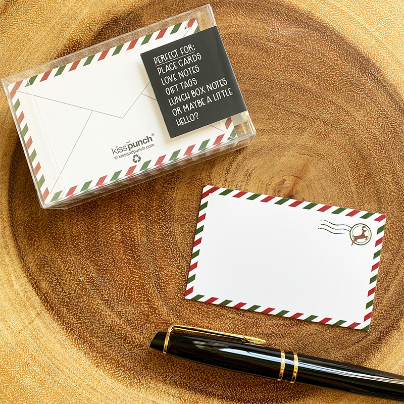 Airmail notecard set with blank cards, red and green striped borders, and a reindeer postmark