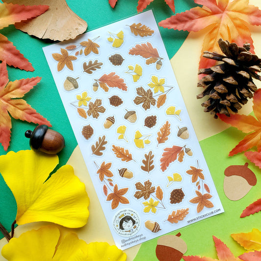 Autumn flora sticker sheet on colorful fall leaves, featuring leaf, flower, and acorn stickers