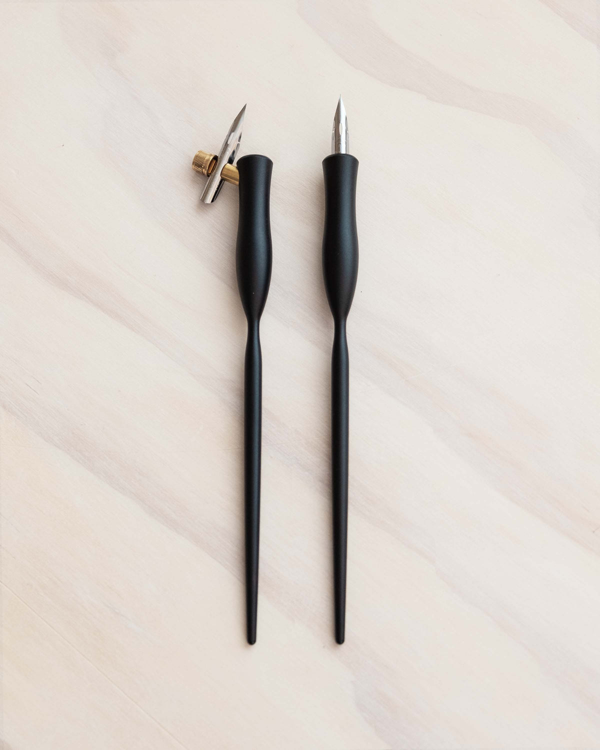 Flourish calligraphy pens with black bodies and gold nibs
