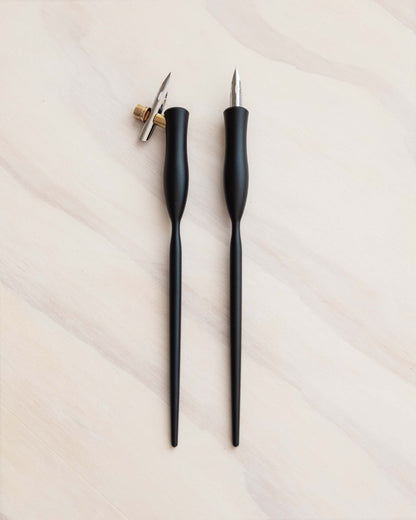 Flourish calligraphy pens with black bodies and gold nibs