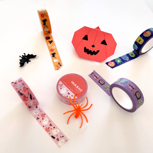 Assorted washi tape rolls and strips with Halloween characters and spooky motifs