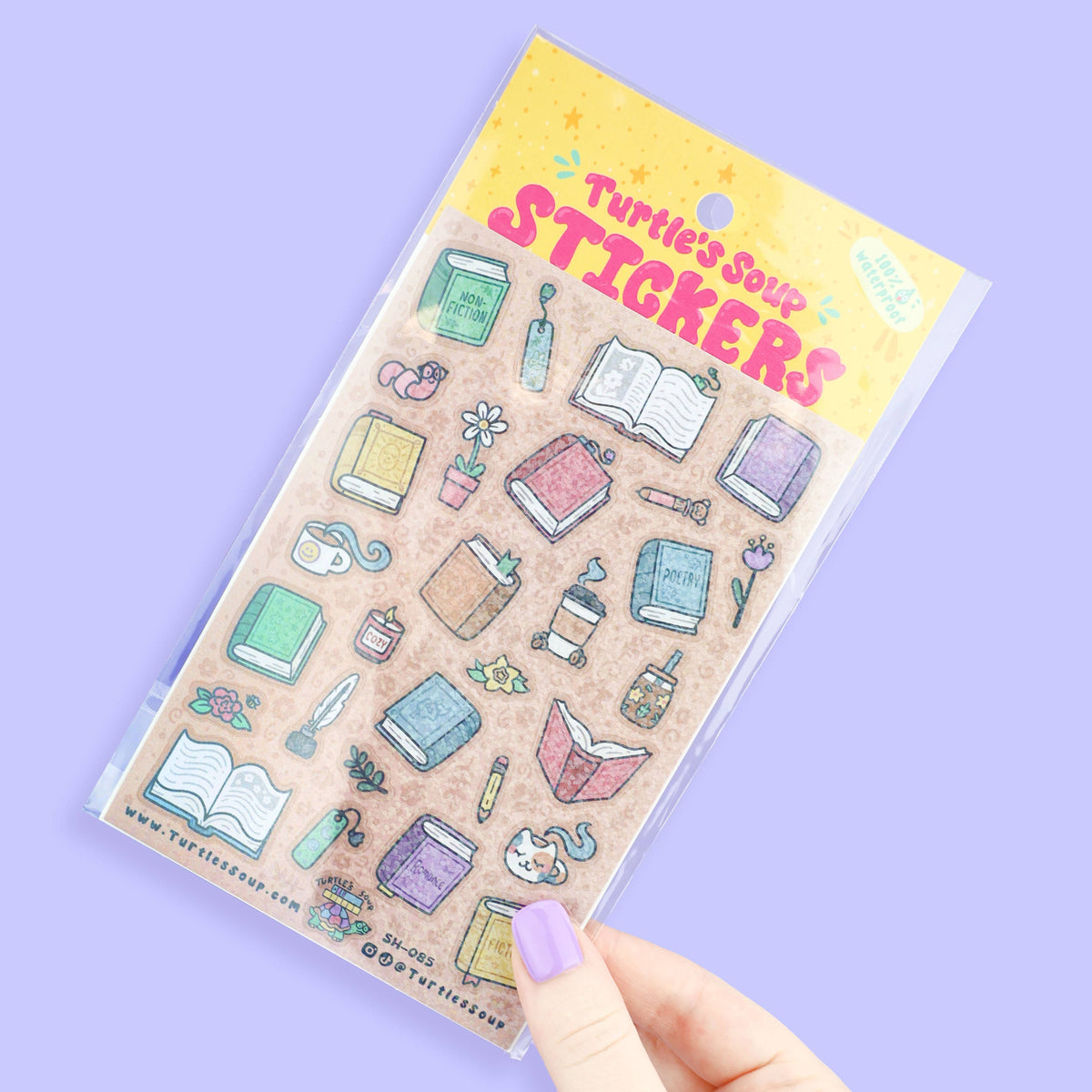 Glitter sticker sheet held in hand, featuring books and stationery icons