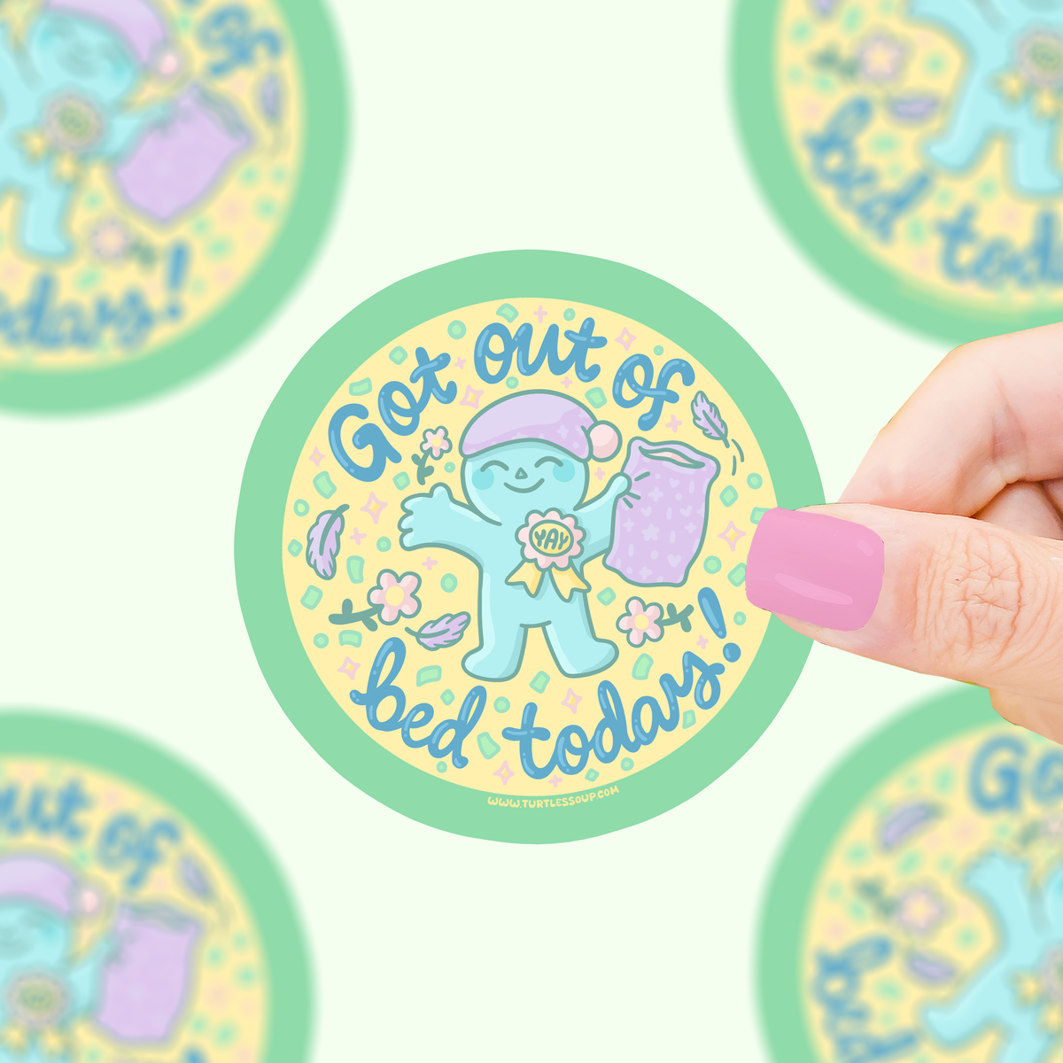 Round vinyl sticker with blue character and text saying 'Get out of bed today'