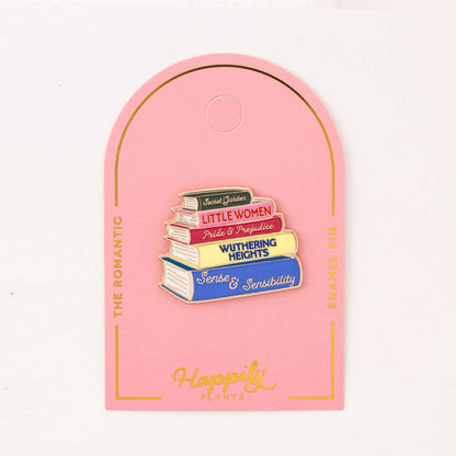 Romantic enamel book pin backing card showing a stacked book pin and 'Happily' text