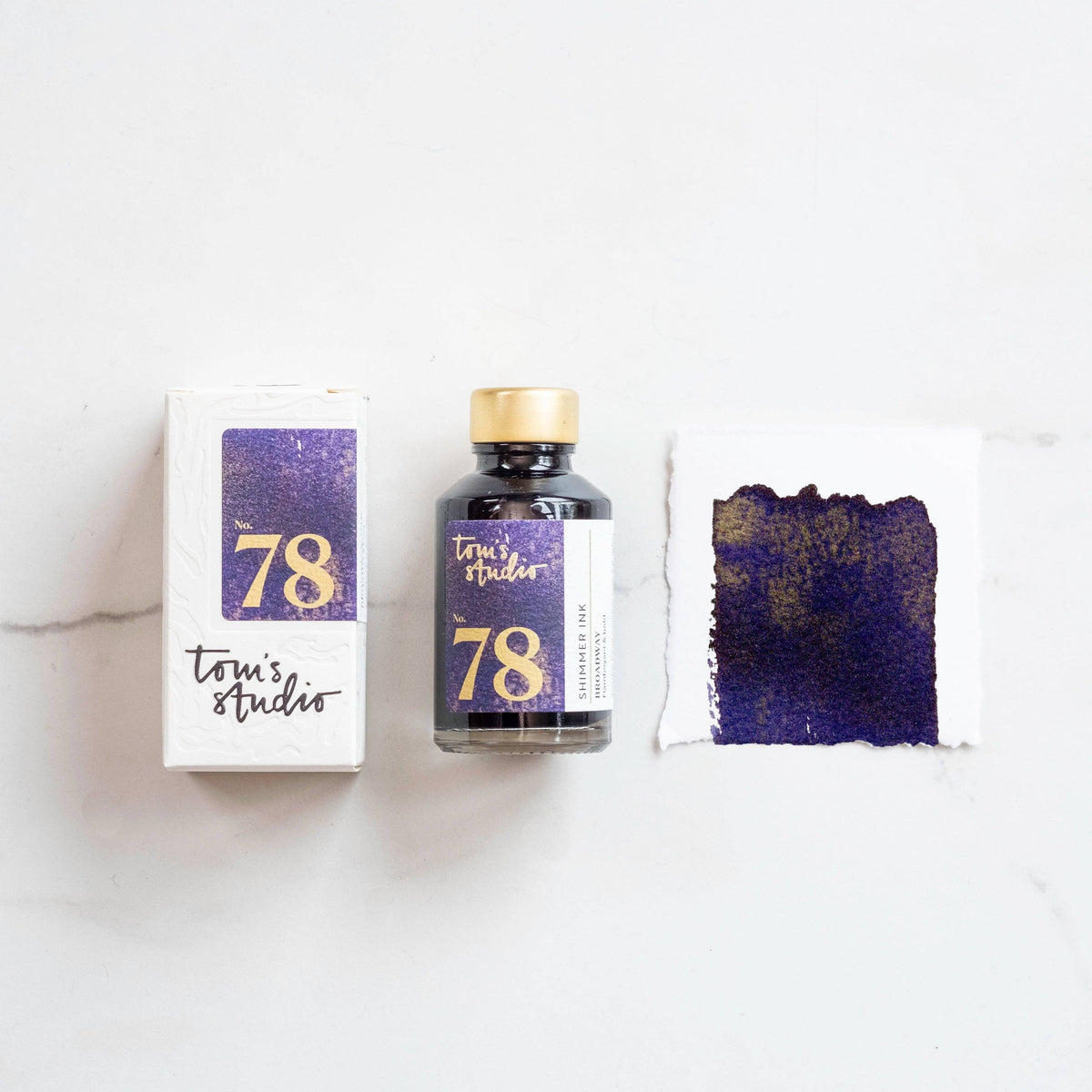 Shimmer ink bottle with purple glitter swatch and packaging box, Broadway 78