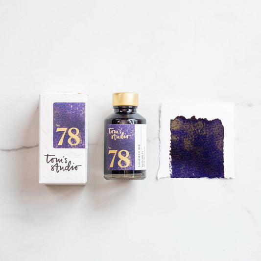Shimmer ink bottle with purple glitter swatch and packaging box, Broadway 78