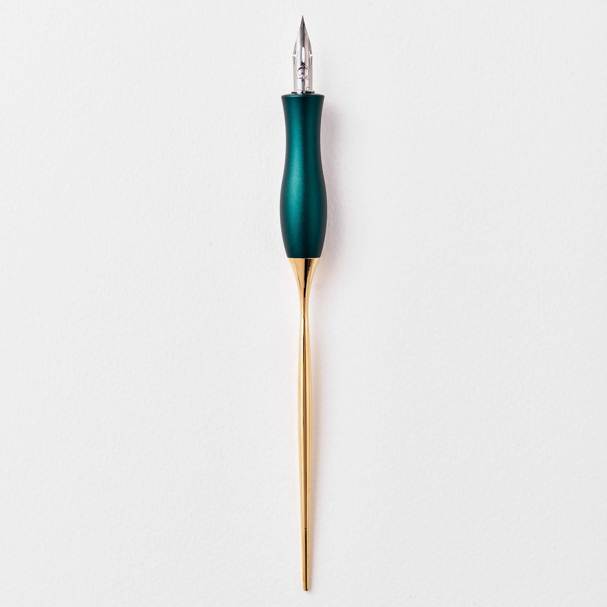 Teal calligraphy pen with oblique nib and gold accents, upright view