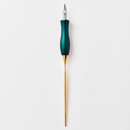 Teal calligraphy pen with oblique nib and gold accents, upright view