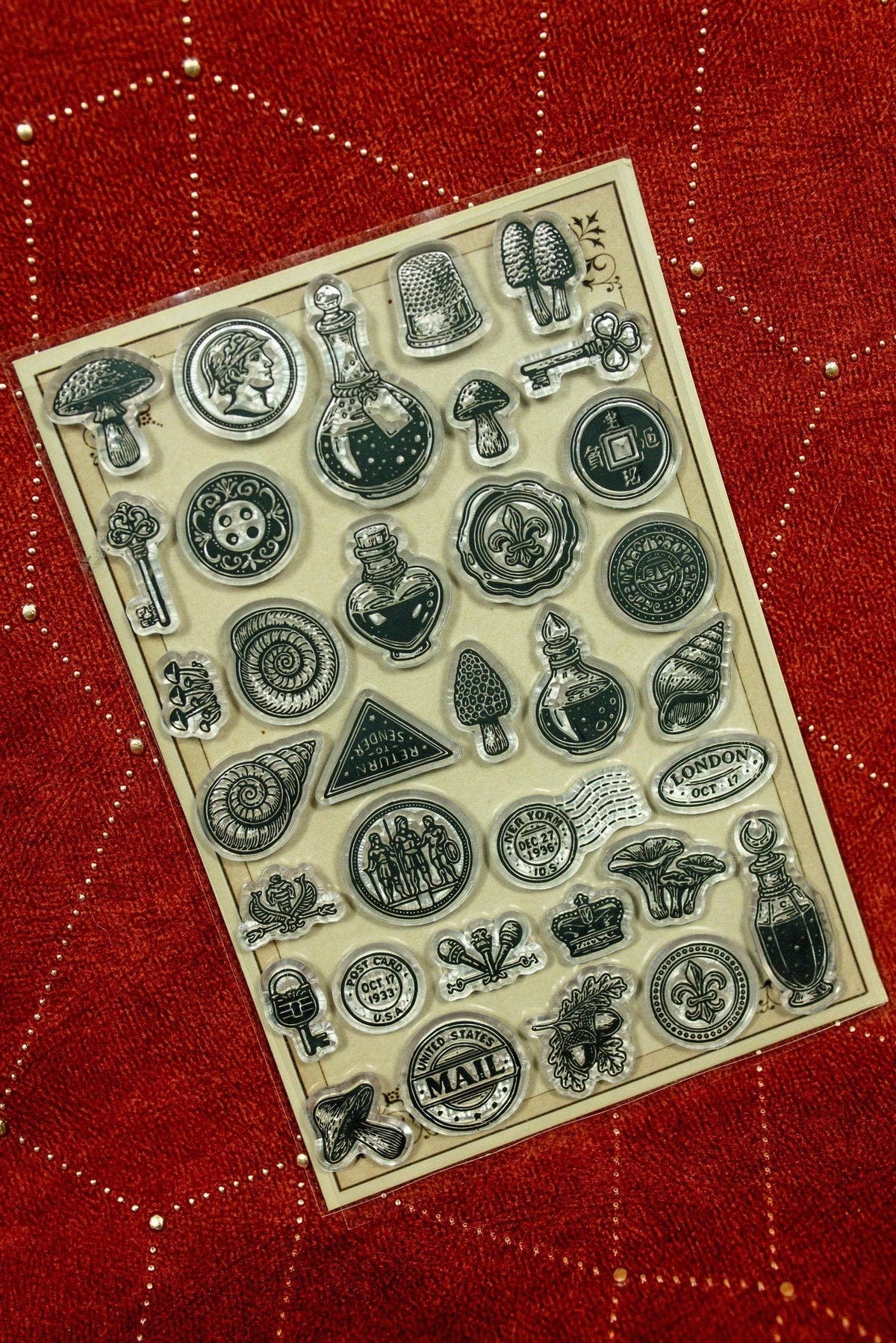Clear acrylic stamp set with vintage mail icons and gadgets, various circular emblems