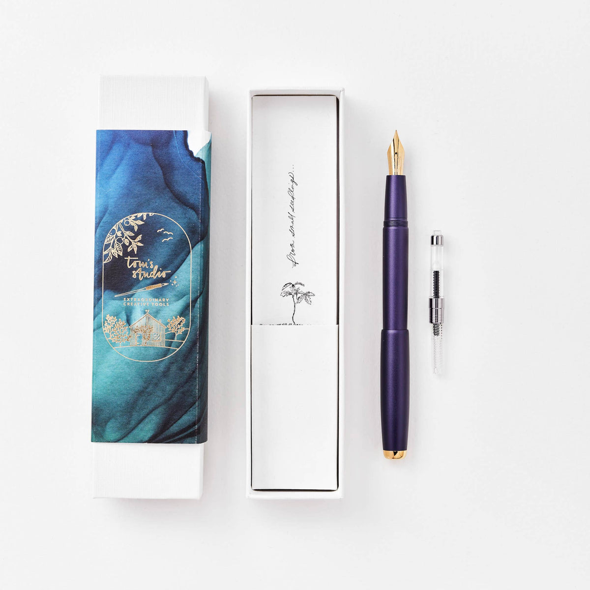Purple fountain pen with gold nib, shown in a gift box set with cartridge
