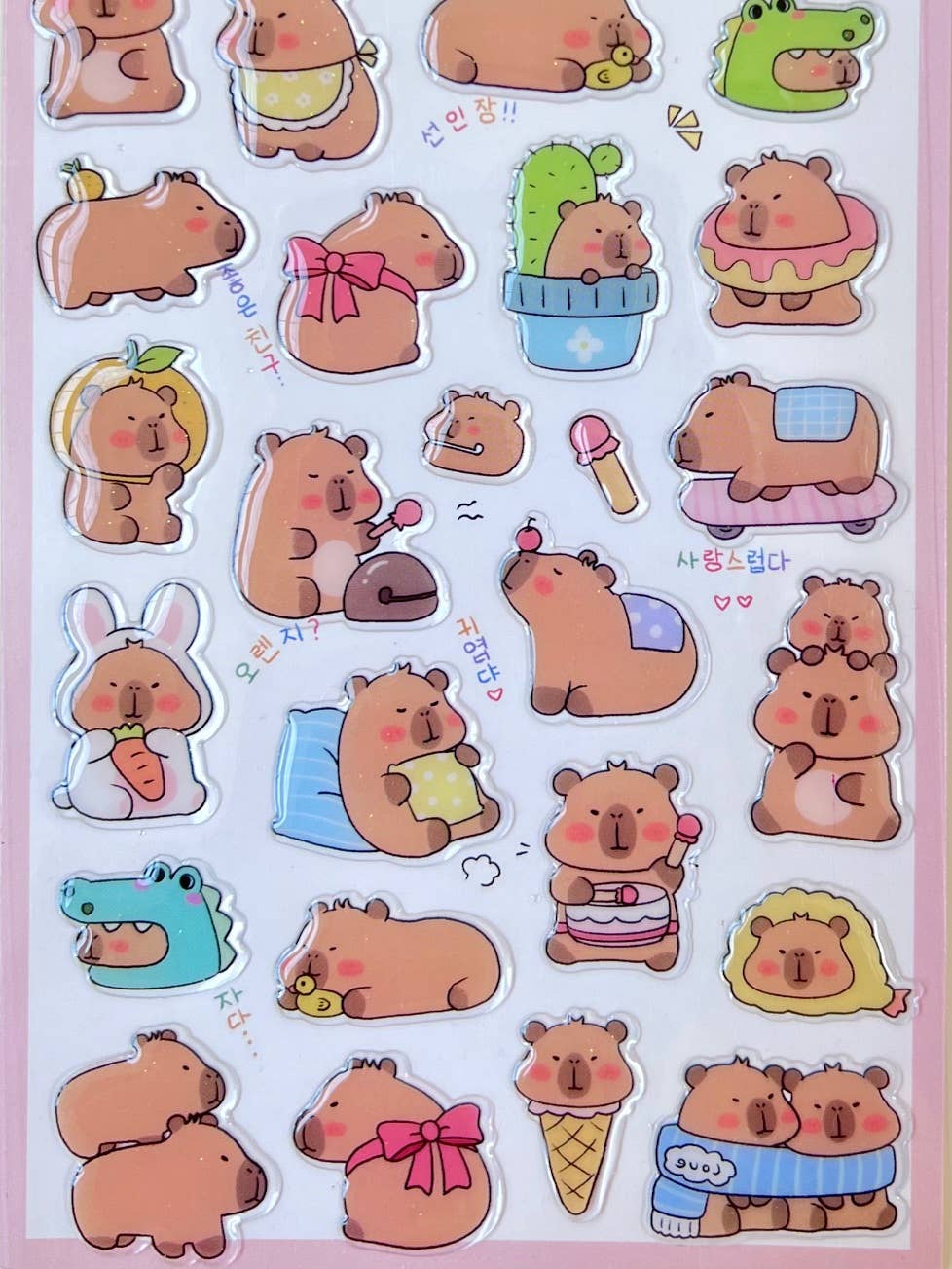 Capybara Baby sticker sheet close-up of assorted capybara, bunny, and food stickers