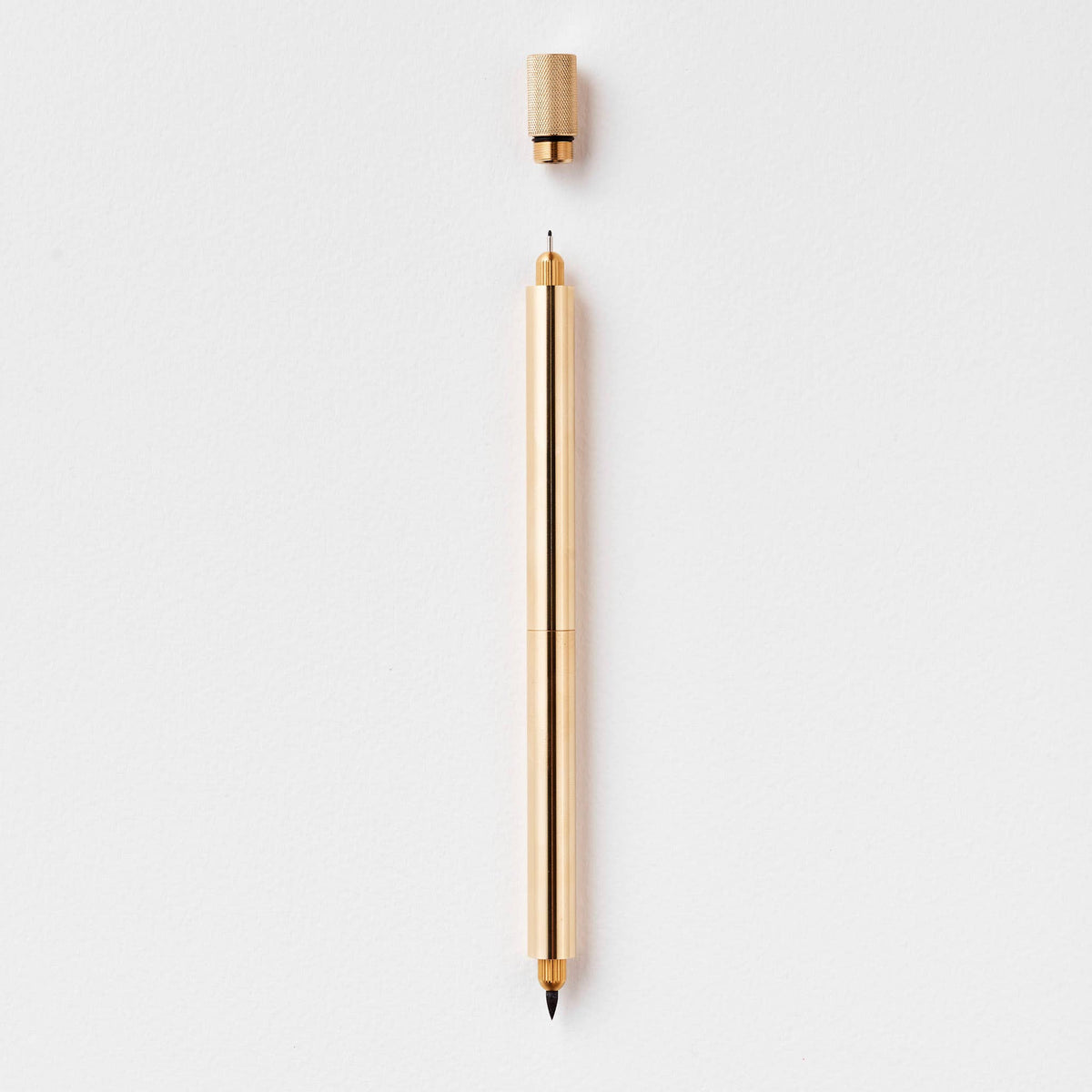 Brass metal pen with pointed nib and end cap
