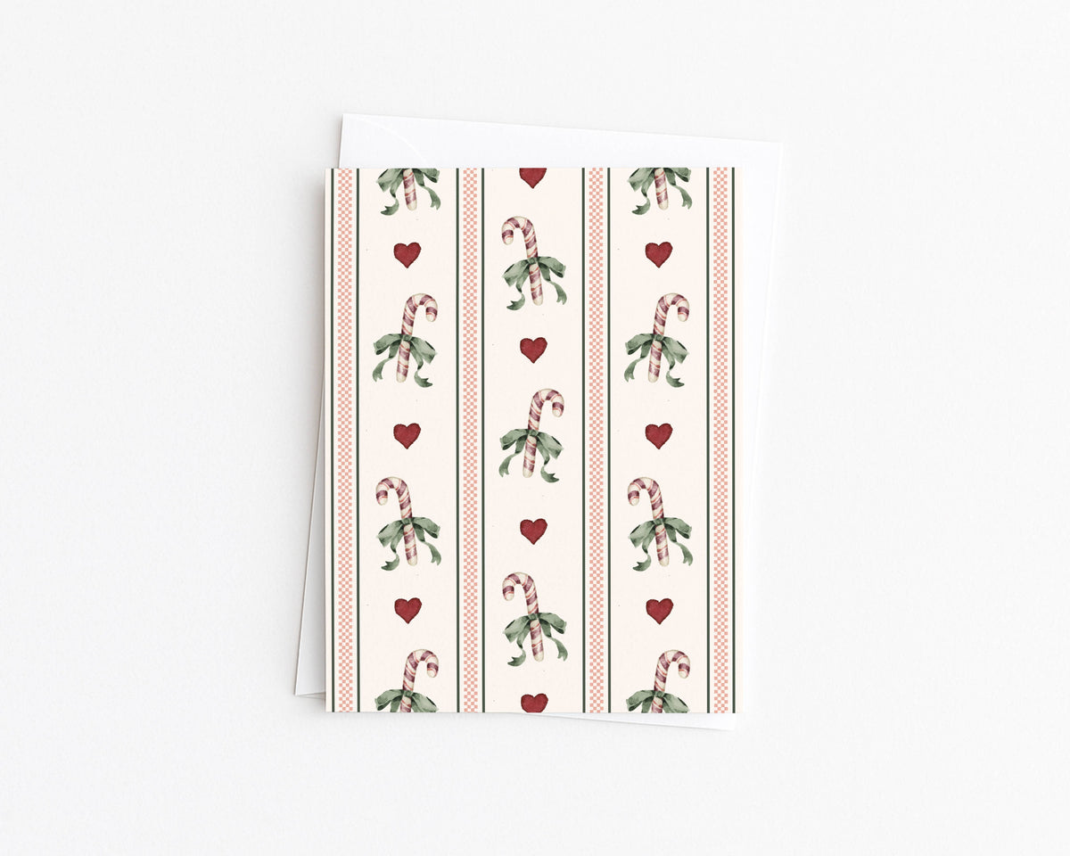 Christmas note card with candy cane bow cross-stitch pattern and red hearts
