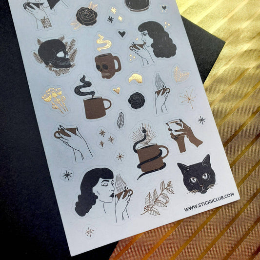 Close-up of coffee-and-skull sticker sheet with cups, roses, and cat skull art