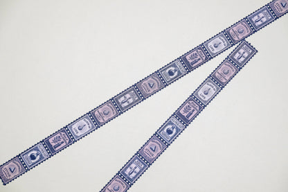 Blue stamp-pattern washi tape strips, close-up of repeating icons