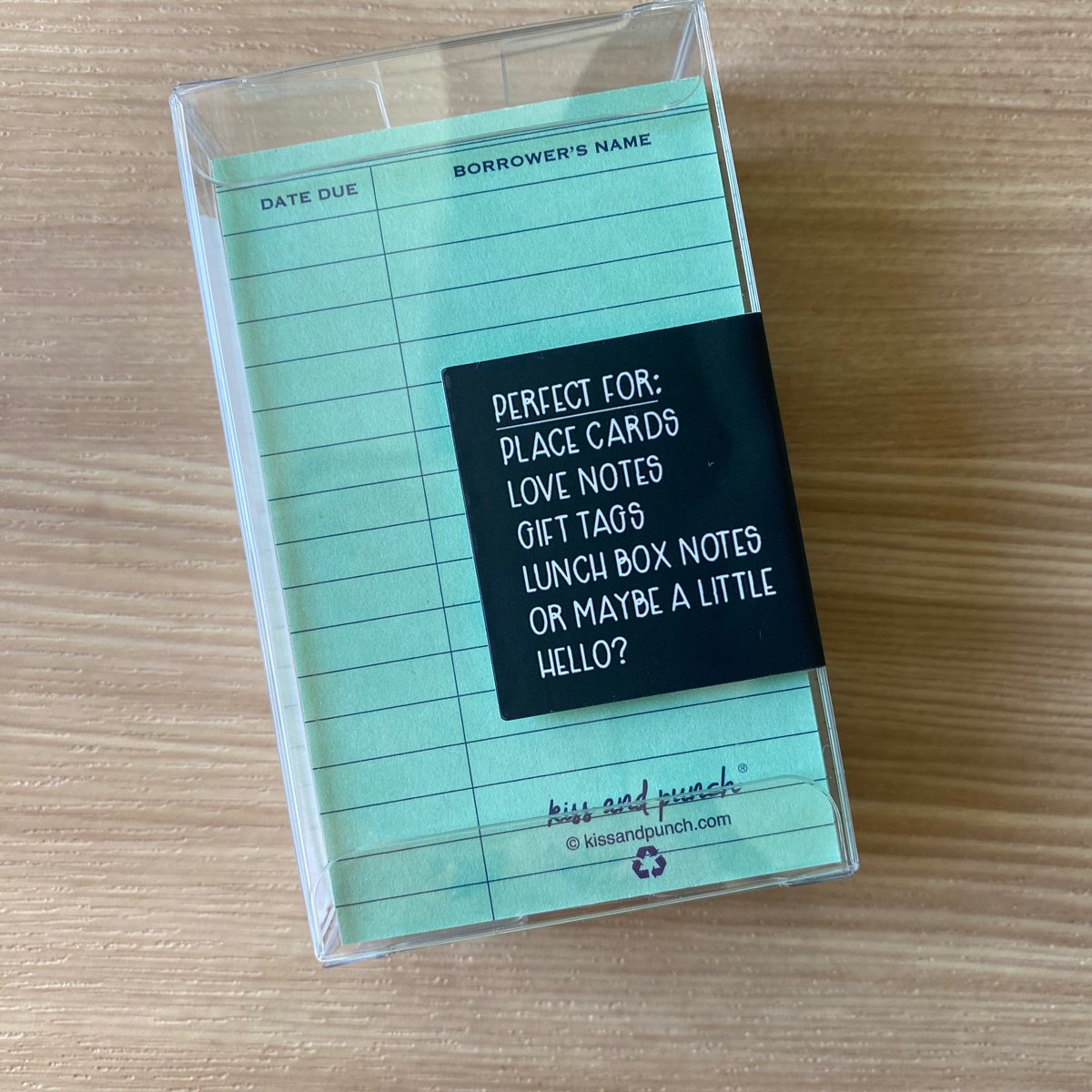 Blue ruled library card notecards in a clear box, showing the reverse packaging label