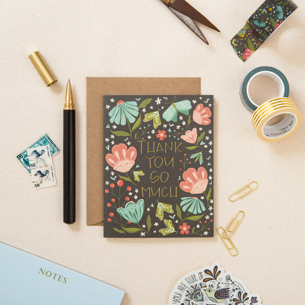 Floral thank-you card with gold foil lettering and kraft envelope