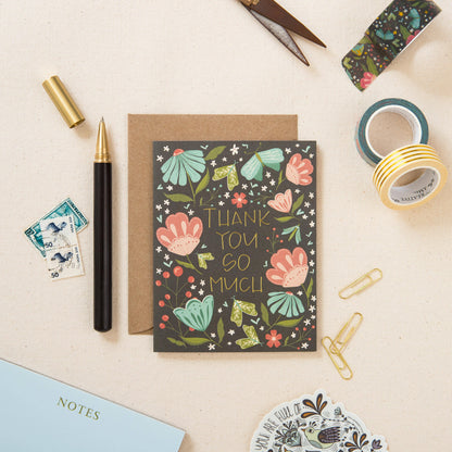 Floral thank-you card with gold foil lettering and kraft envelope