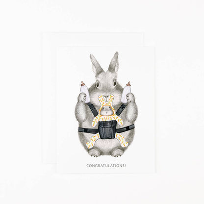 Greeting card with gray bunny parent holding baby bottles and “CONGRATULATIONS!”