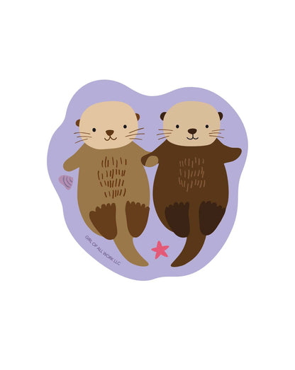 Sea otters vinyl sticker with two sea otter faces and a pink star detail