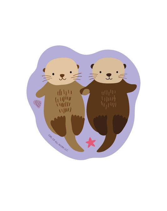 Sea otters vinyl sticker with two sea otter faces and a pink star detail